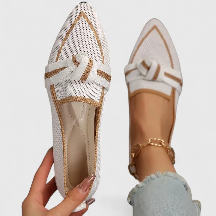 White knit pointed-toe loafers featuring gold trim and knot accent
