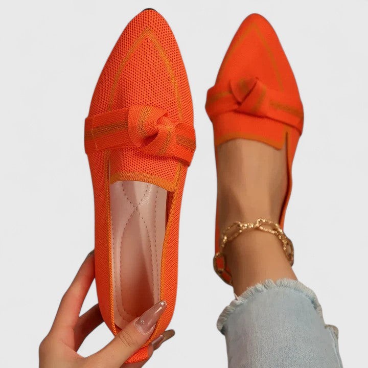 Orange knit pointed-toe loafers with contrast piping and knot detail