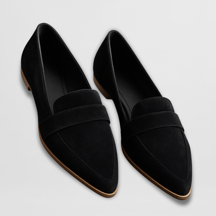 Black suede pointed-toe loafers with penny strap and stitched leather sole