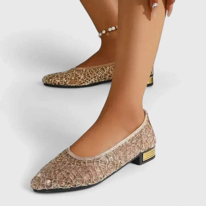 sequined gold ballet flats worn with low block heel detail