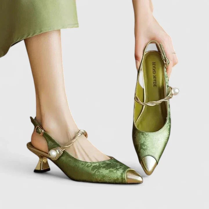 Green brocade slingback heels with pearl accent and gold pointed toe cap