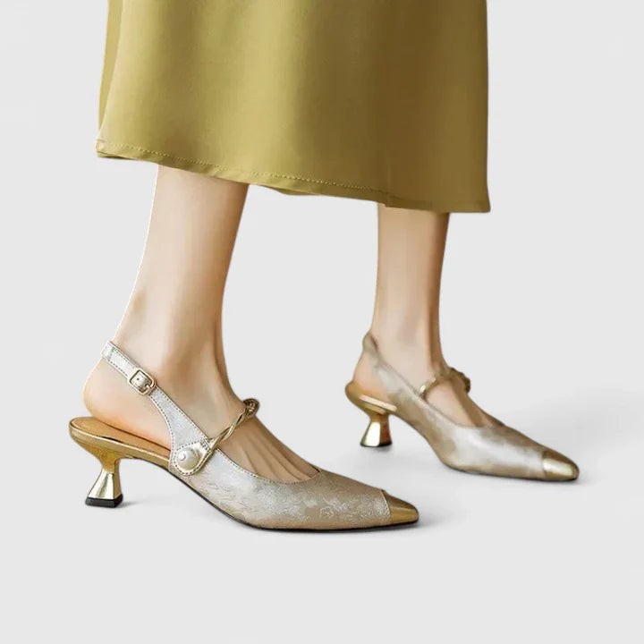 Champagne satin kitten heels with gold buckle strap and pointed toe