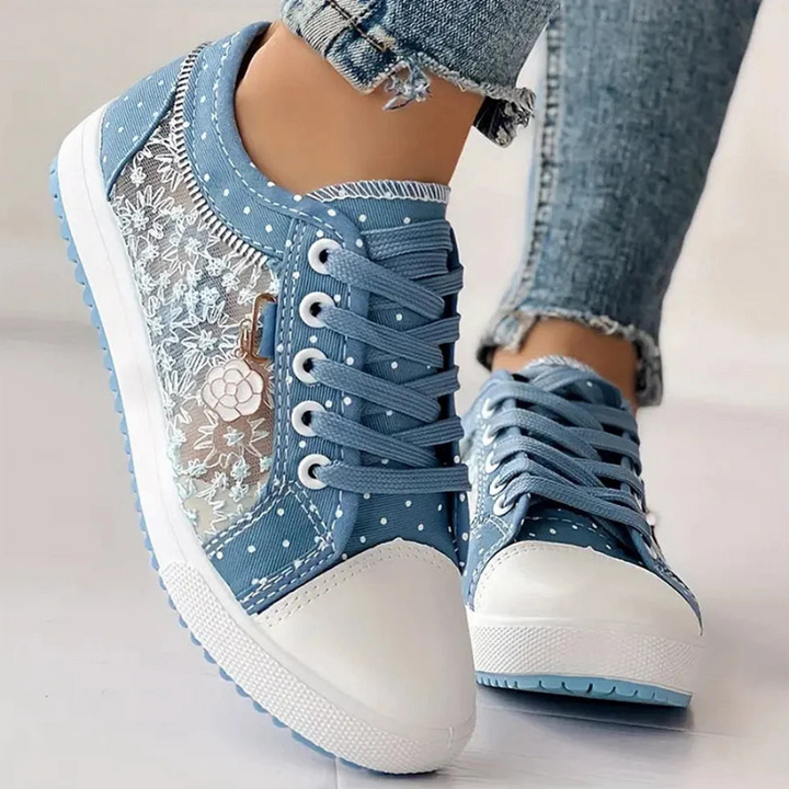 White toe canvas sneakers with blue polka dots and lace side detail