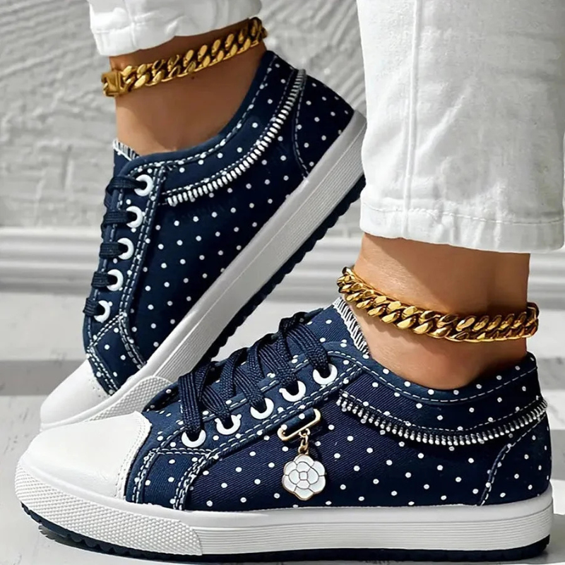 Blue polka dot sneakers with embroidered lace panel and white platform sole