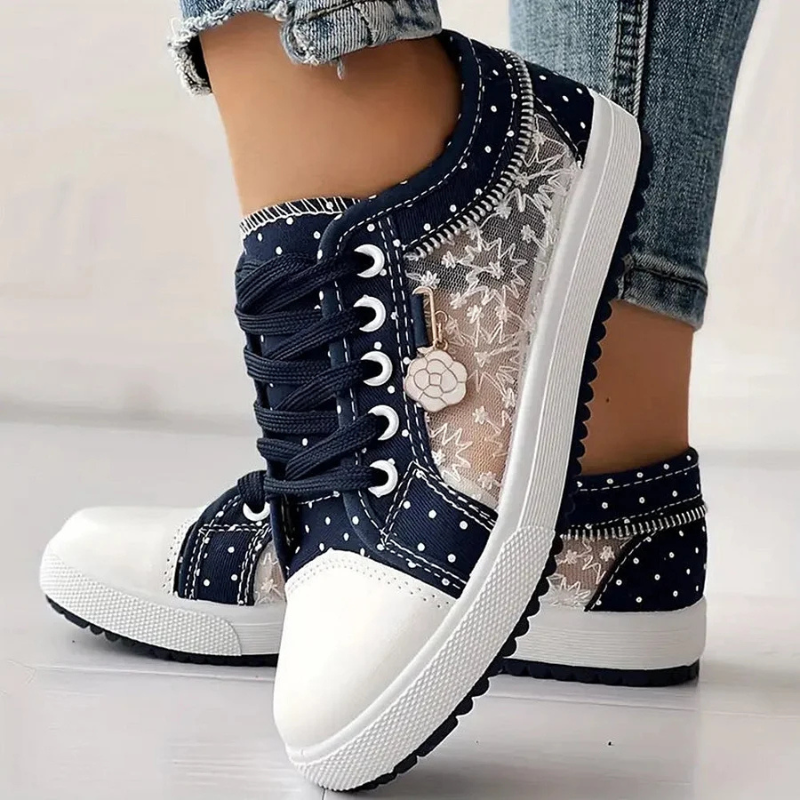 Navy lace-up sneakers with sheer floral mesh panel and white rubber sole