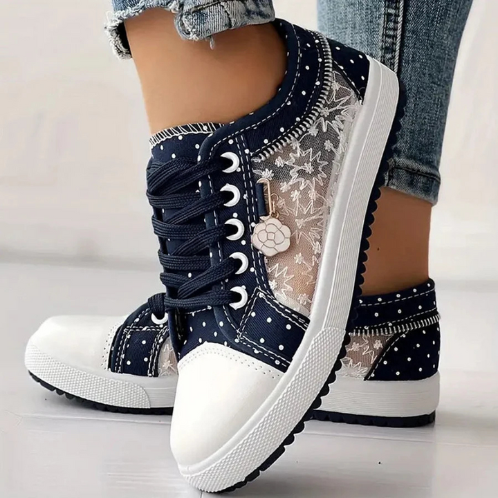 Navy lace-up sneakers with sheer floral mesh panel and white rubber sole