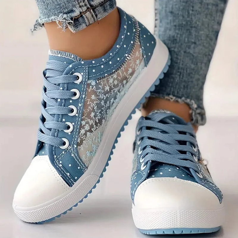 Denim blue canvas sneakers featuring lace overlay and polka dot trim
