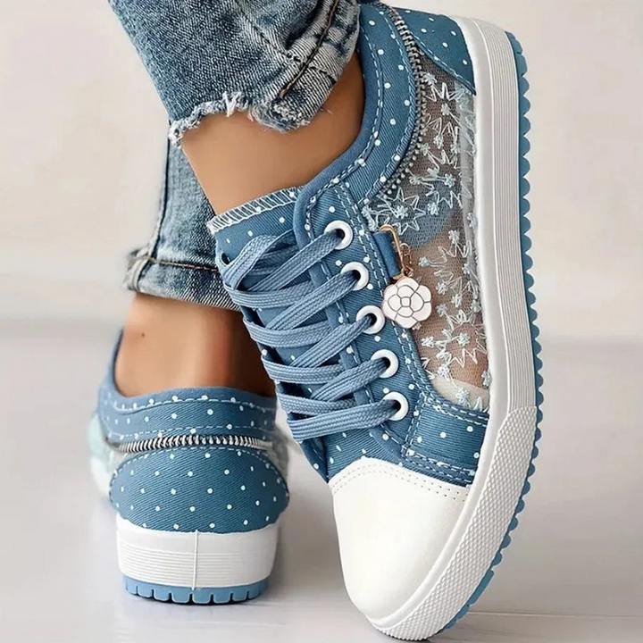 Light blue lace-up sneakers with white sole and floral mesh detail