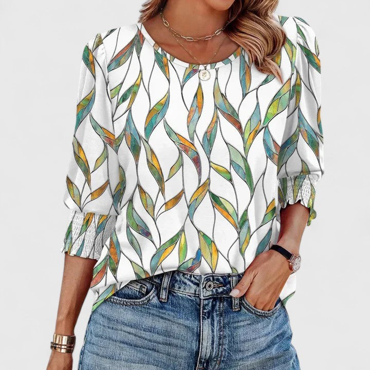 abstract leaf print blouse with puff sleeves and smocked cuffs