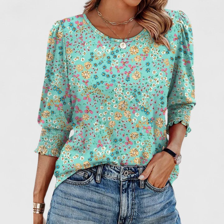 turquoise floral print top with smocked cuff sleeves
