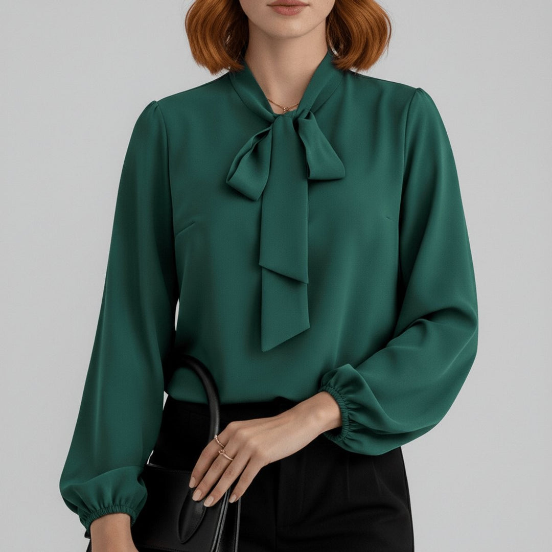 Emerald green bow-tie neck blouse with balloon sleeves and satin finish