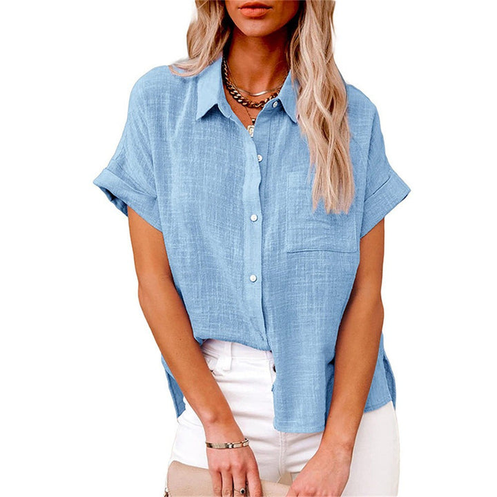 Light blue button-front blouse with front pocket and rolled short sleeves