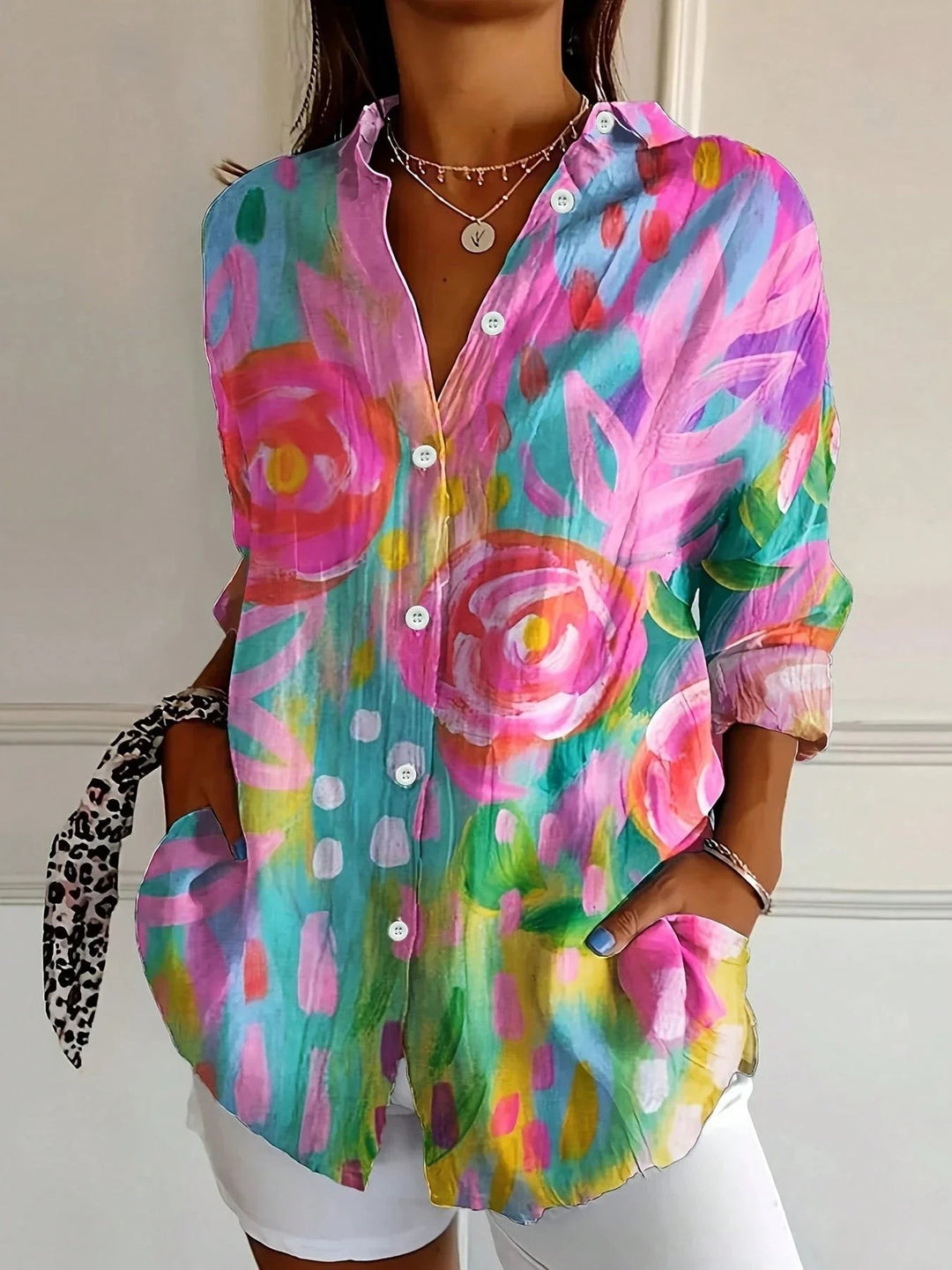 long-sleeve button-down blouse with colorful abstract floral print