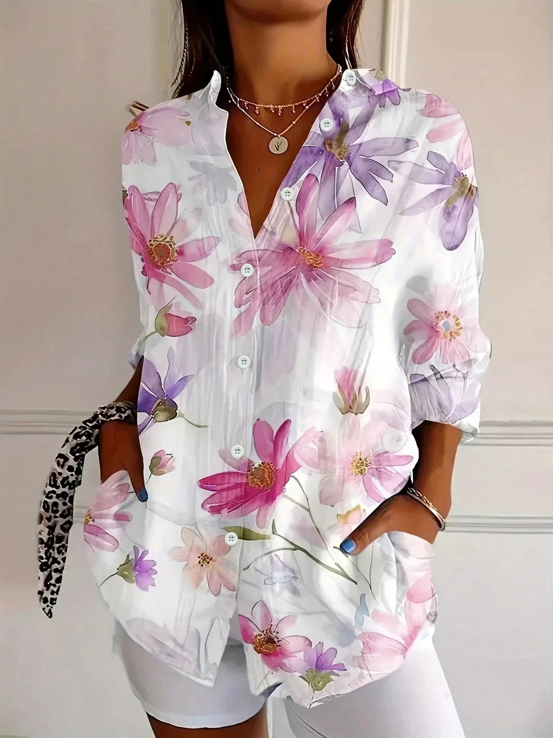 long-sleeve button-down top with soft pink and purple floral print
