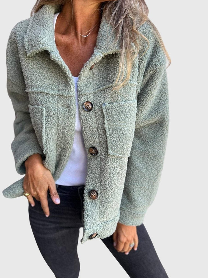 Sage green textured fleece jacket with buttoned front and dual pockets