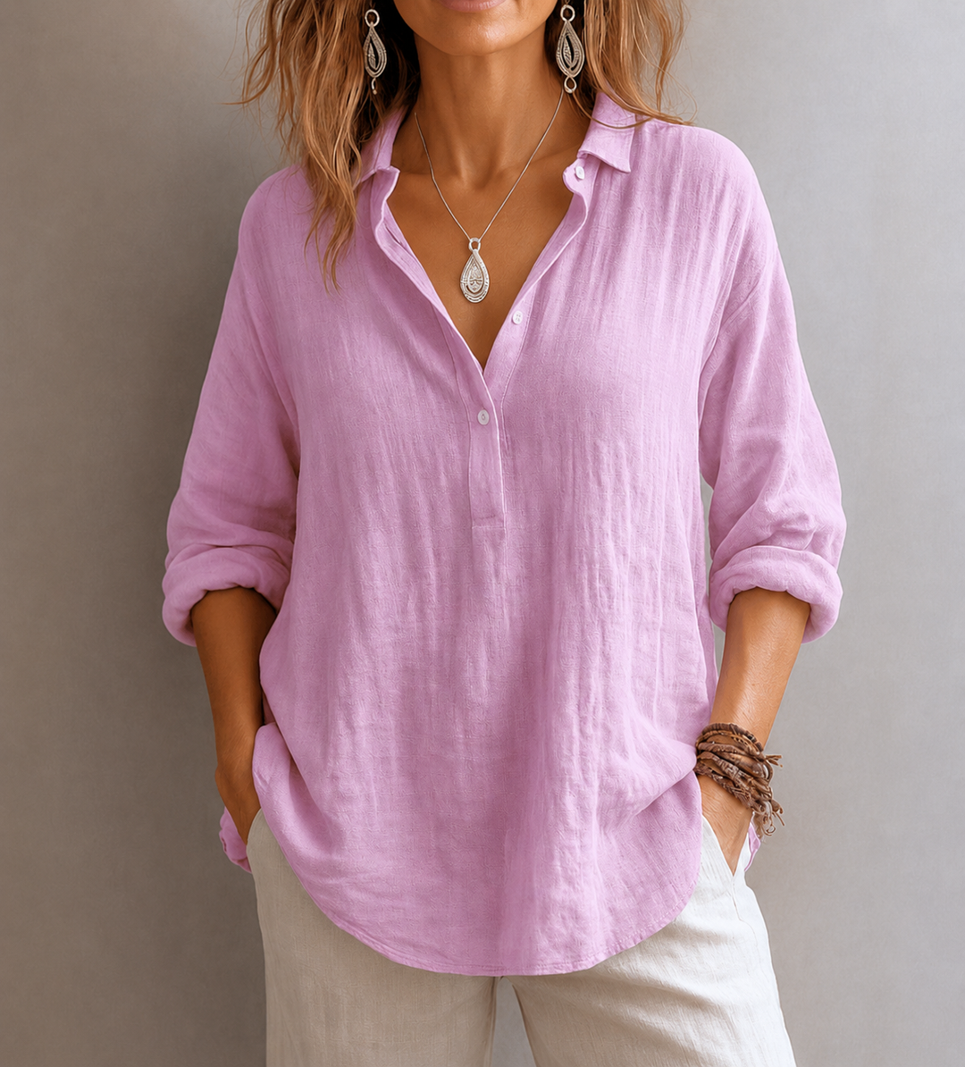 Pink linen blouse with V-neck collar and rolled long sleeves