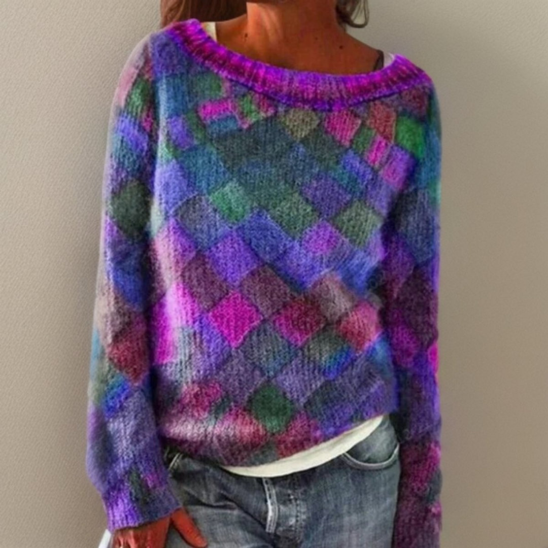 Multicoloured diamond-pattern knit jumper with boat neckline, worn over jeans