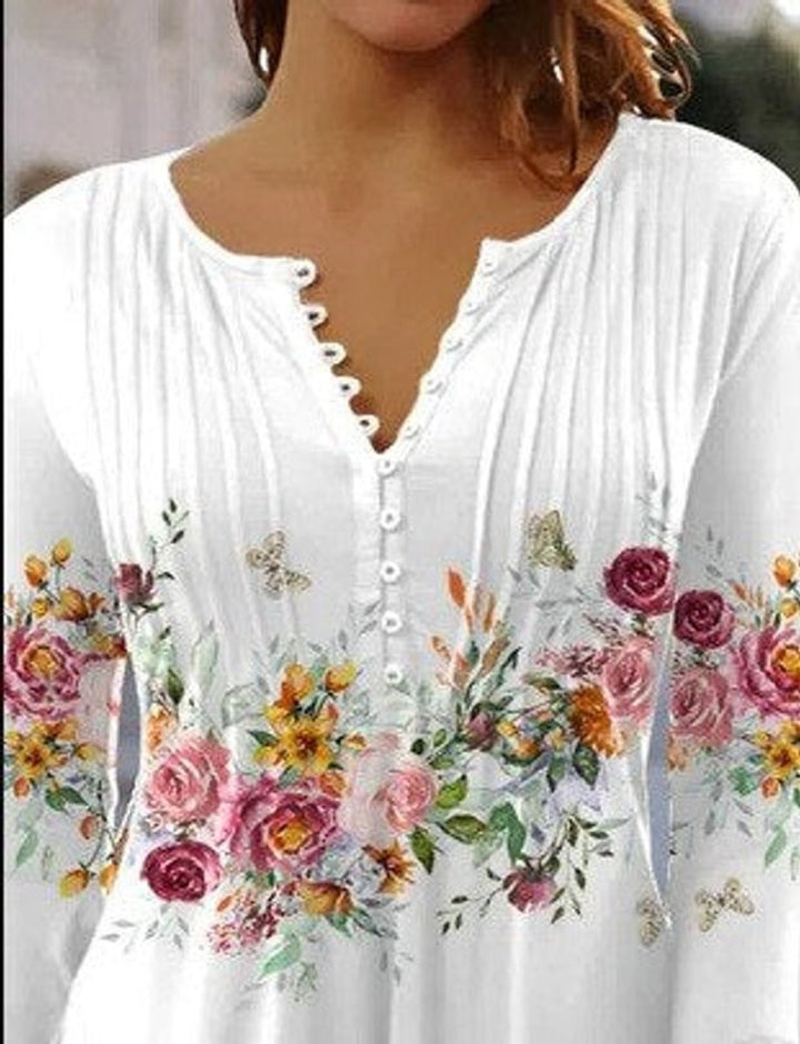 White floral henley blouse with scalloped button placket, close-up view