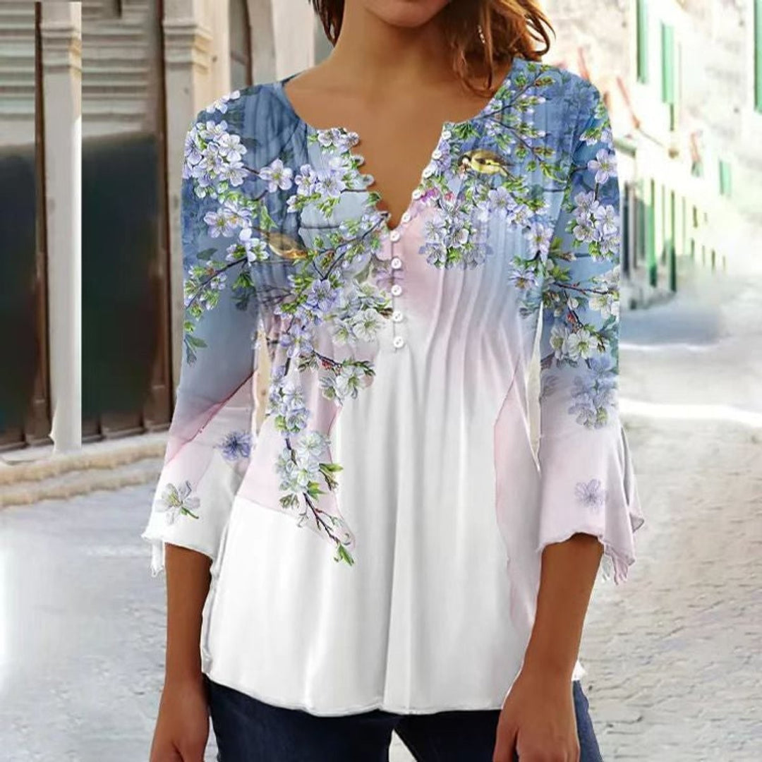 White henley top with blue floral bird print and ruffled sleeves