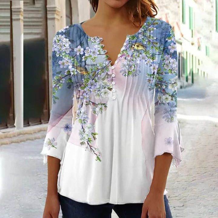 White henley top with blue floral bird print and ruffled sleeves
