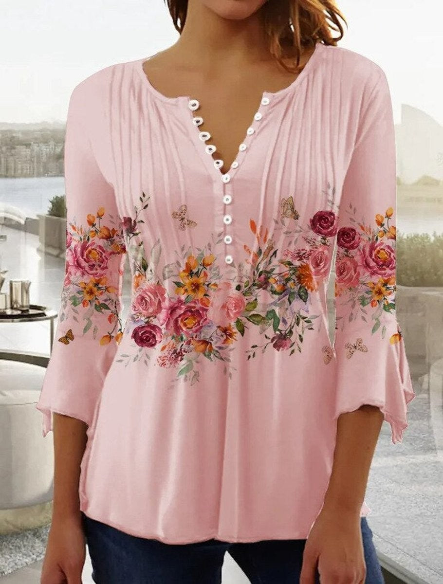 Pink floral henley blouse with bell sleeves and scalloped neckline