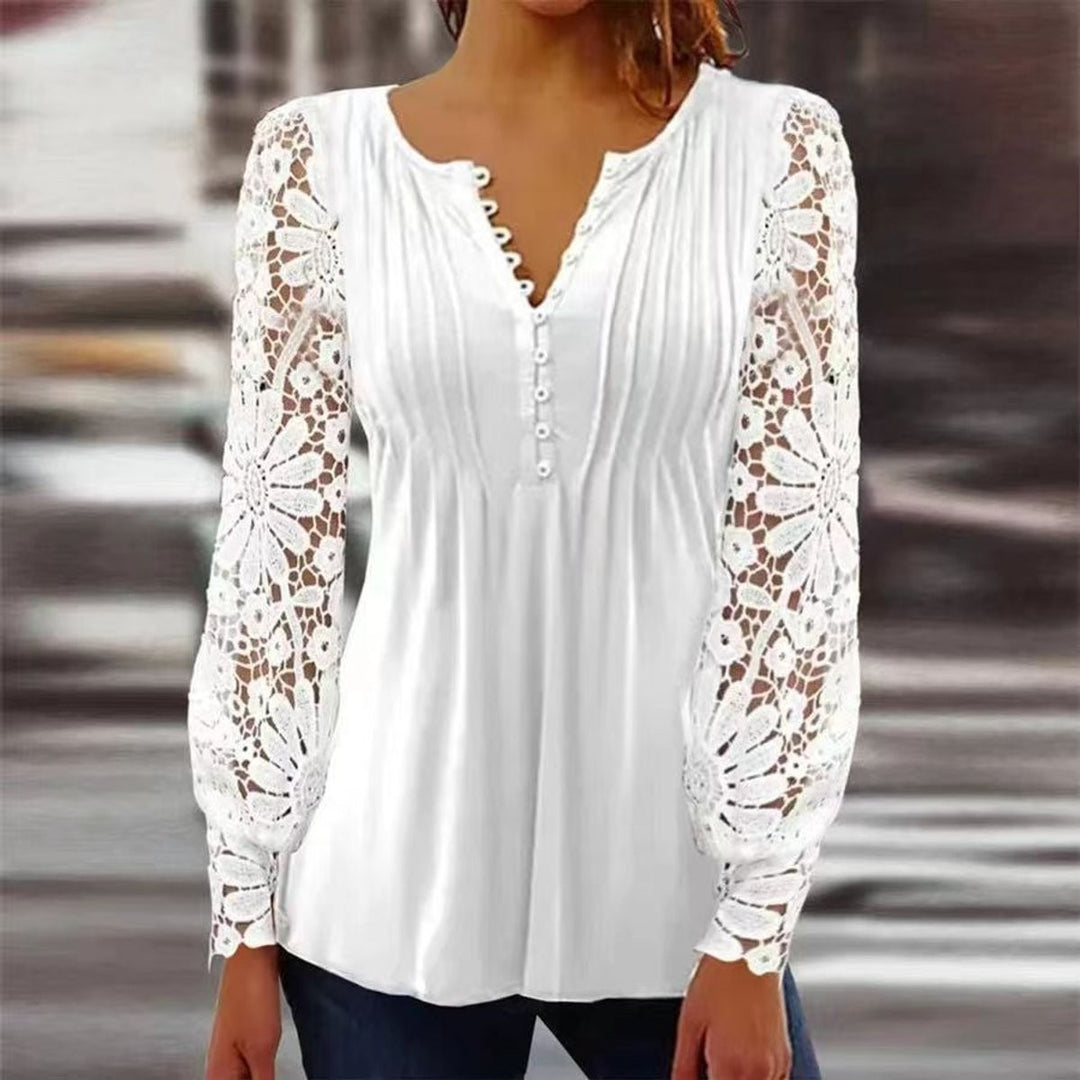 White henley blouse featuring lace crochet long sleeves and pintuck front