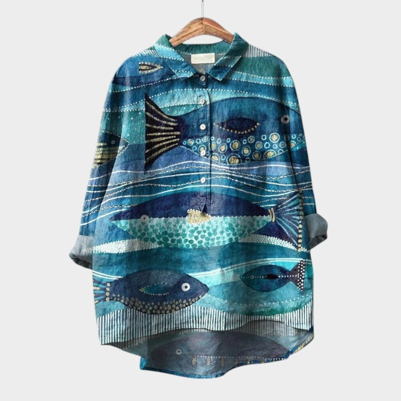 Teal high-low blouse featuring an artistic watercolor fish and wave print