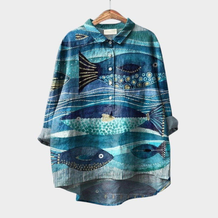 Teal high-low blouse featuring an artistic watercolor fish and wave print