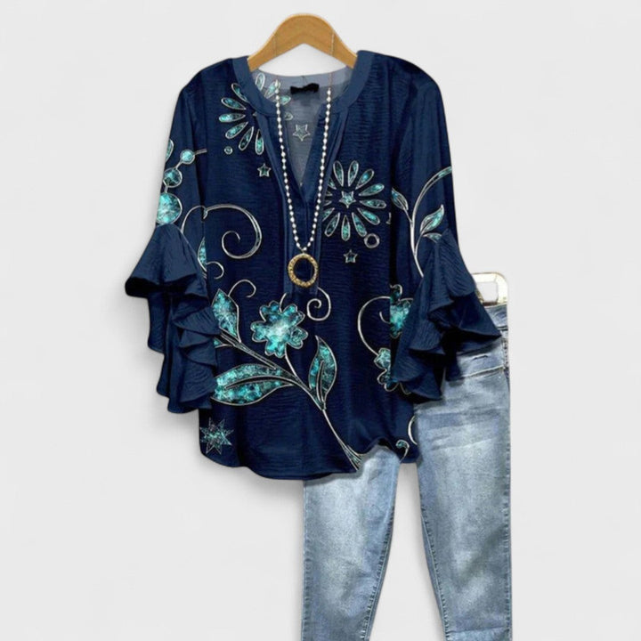 Navy blouse with turquoise floral embroidery print and ruffle sleeves