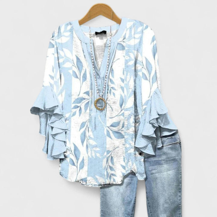 Light blue leaf print blouse featuring tiered ruffle sleeve detail