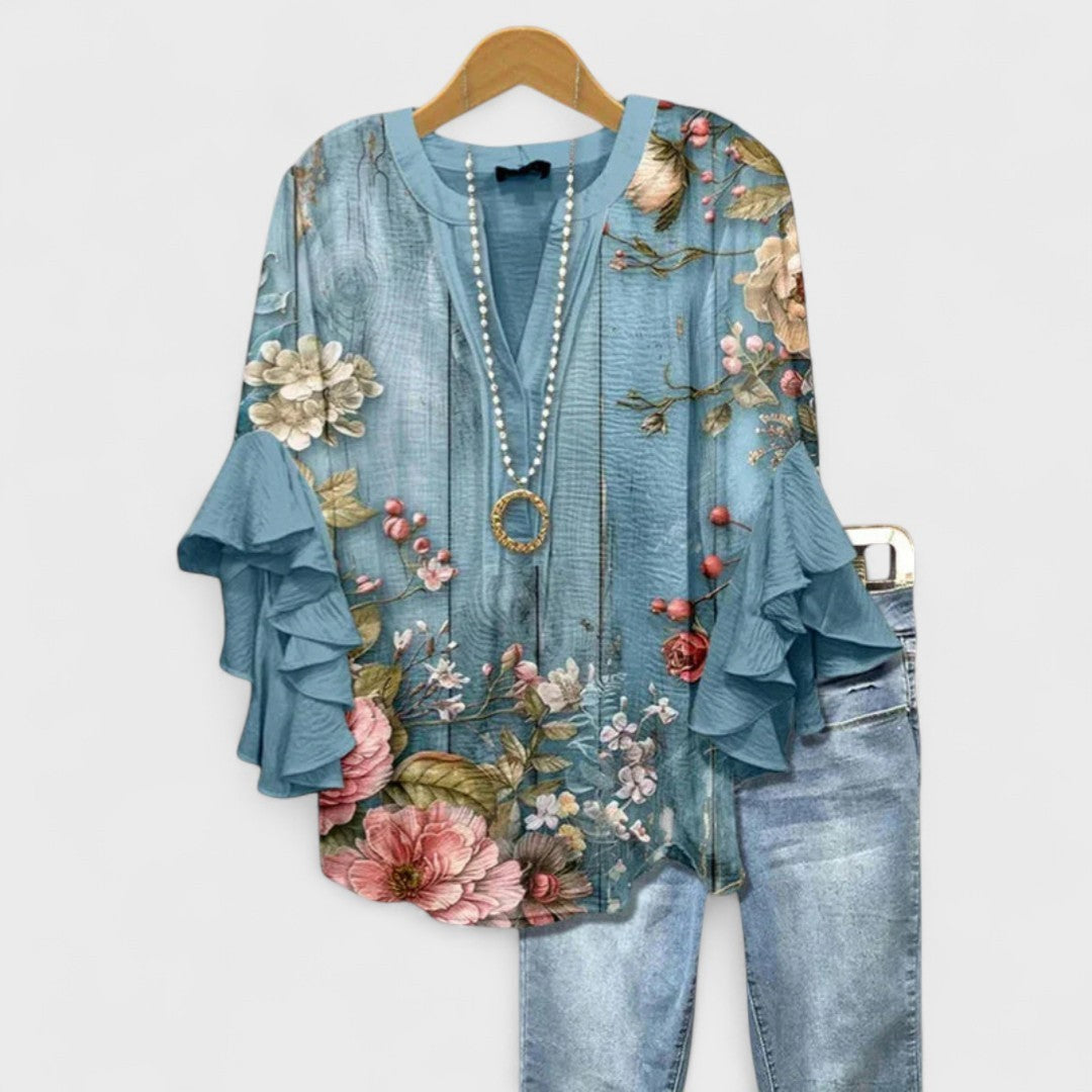 Dusty blue floral blouse with woodgrain print and ruffle sleeves