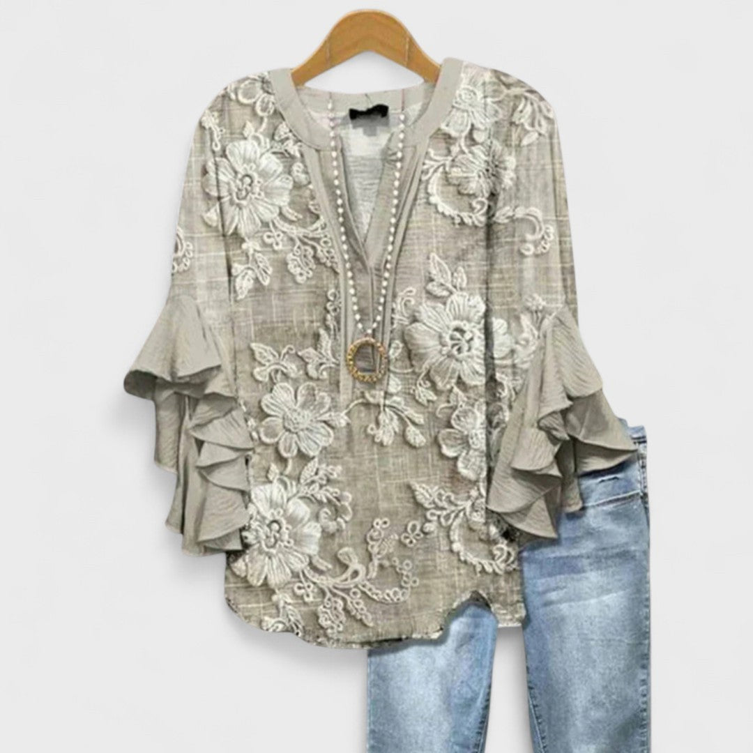 Taupe blouse with white lace floral print and ruffled sleeves