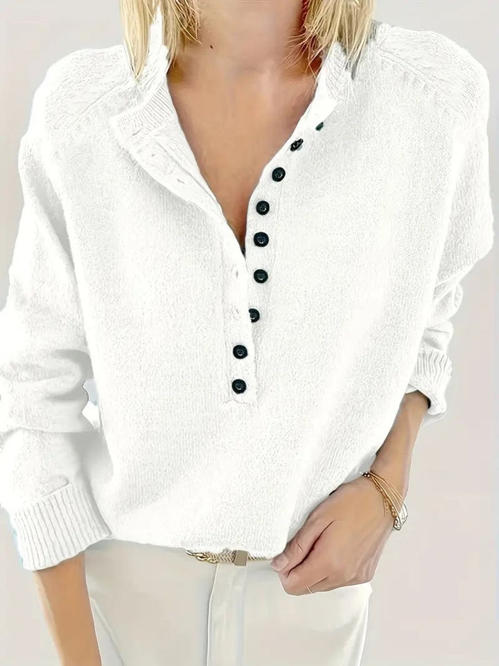 White knit jumper with button-up collar and long sleeves