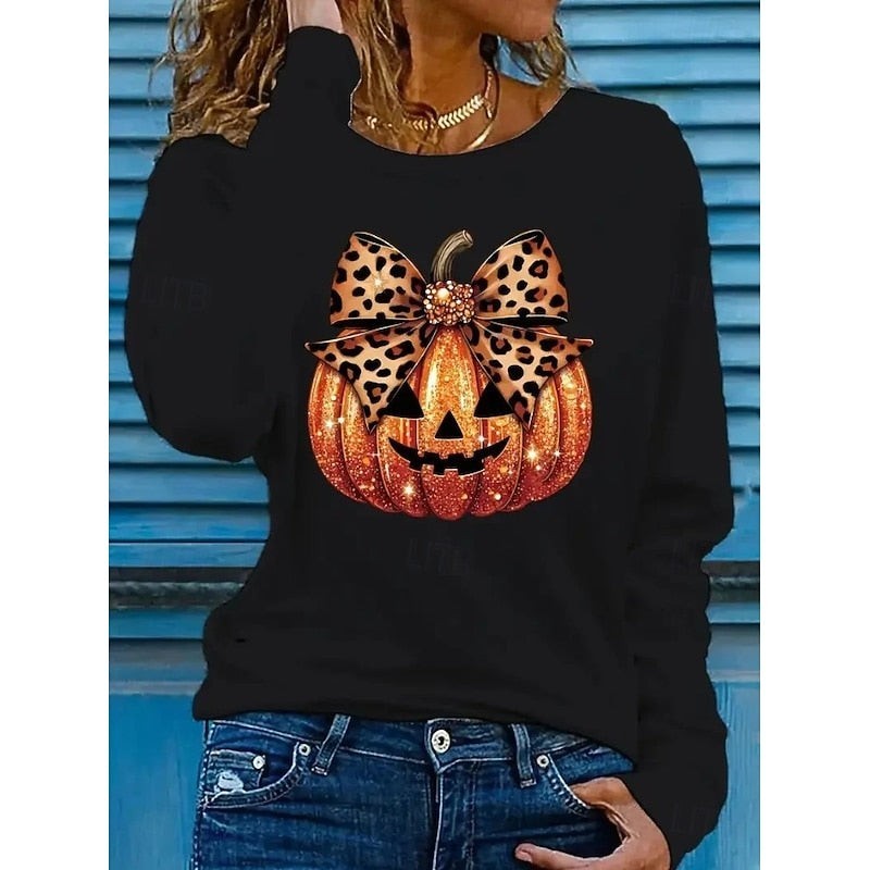 black sweatshirt with sequined jack-o'-lantern face and leopard print bow