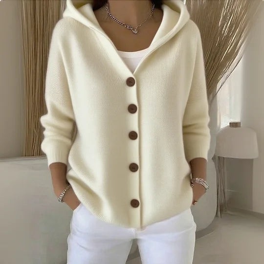 Cream knitted hooded cardigan featuring brown buttons and long sleeves