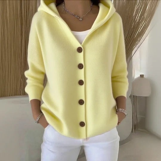 Pale yellow knit cardigan with hood, brown buttons and relaxed fit