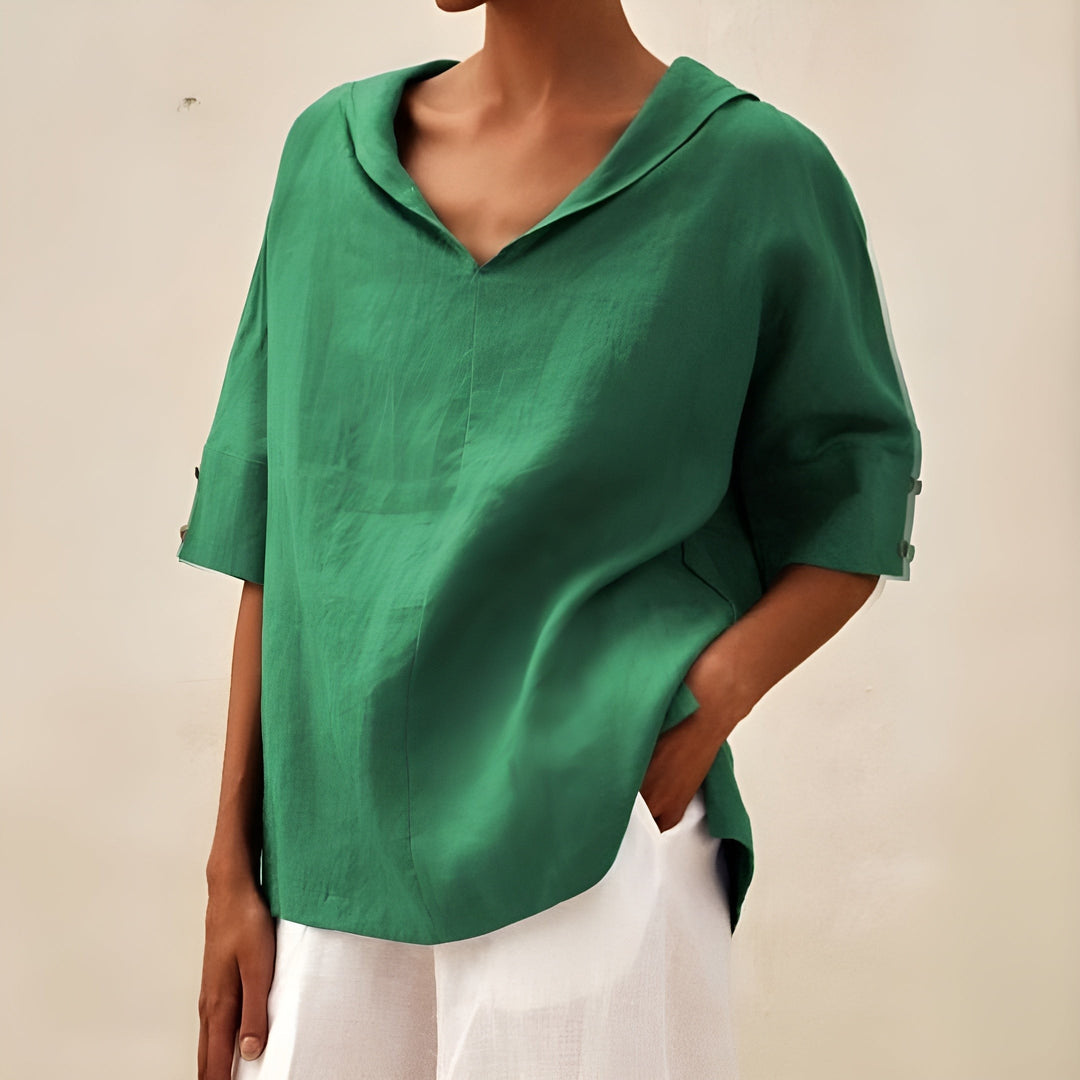 Emerald green V-neck blouse with wide button-cuff sleeves