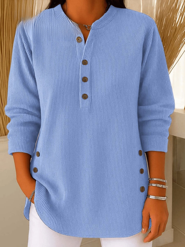 Light blue ribbed henley tunic with button-front placket and side buttons