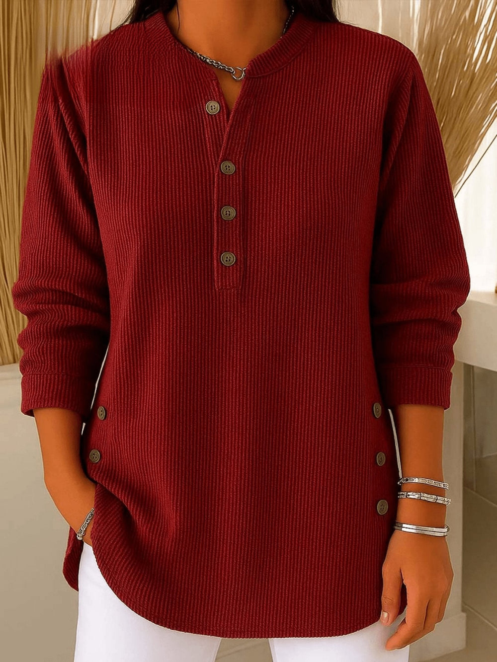 Burgundy ribbed henley tunic top featuring long sleeves and side button details