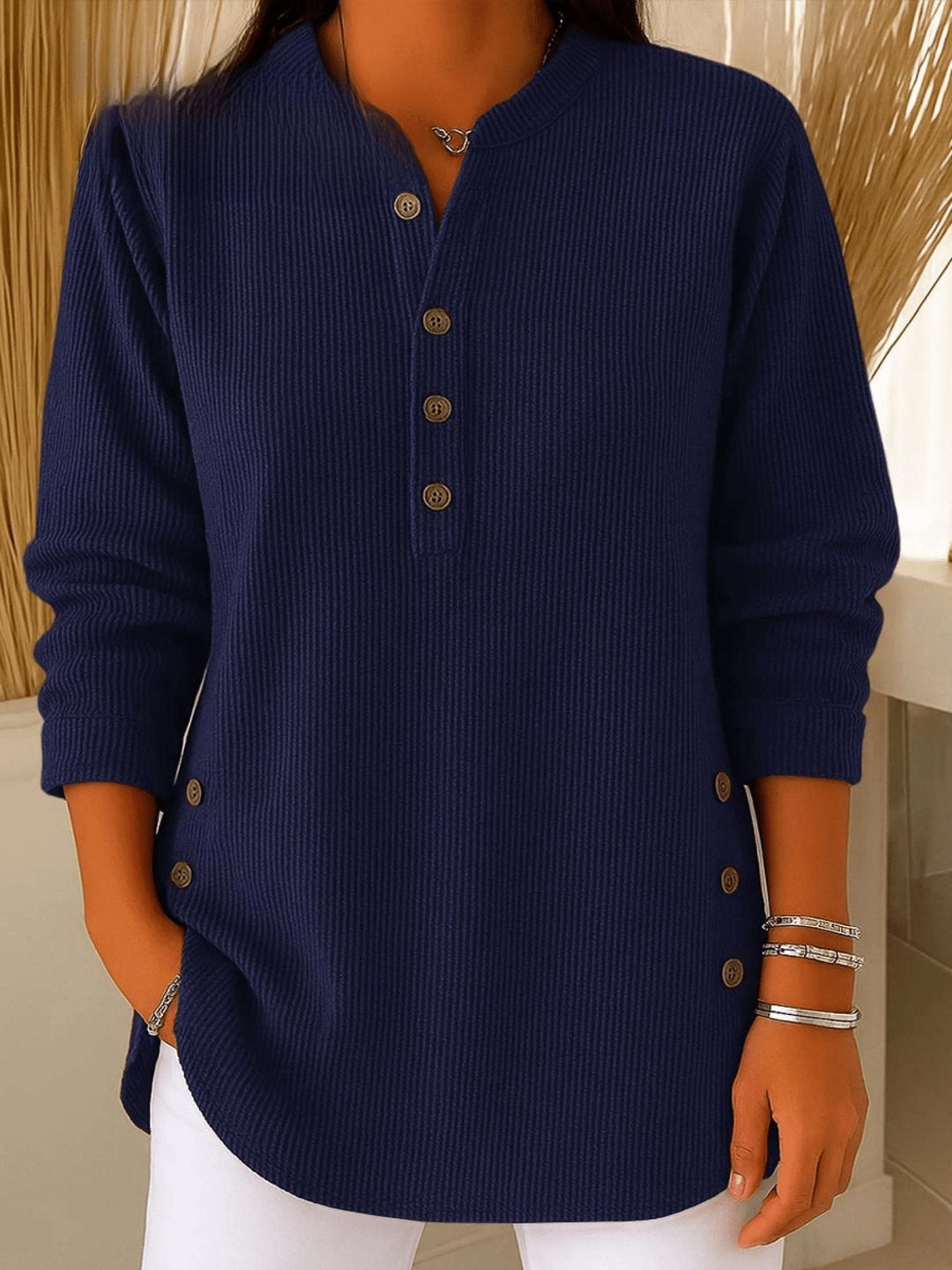Navy blue ribbed knit henley tunic with buttoned V-neckline and long sleeves