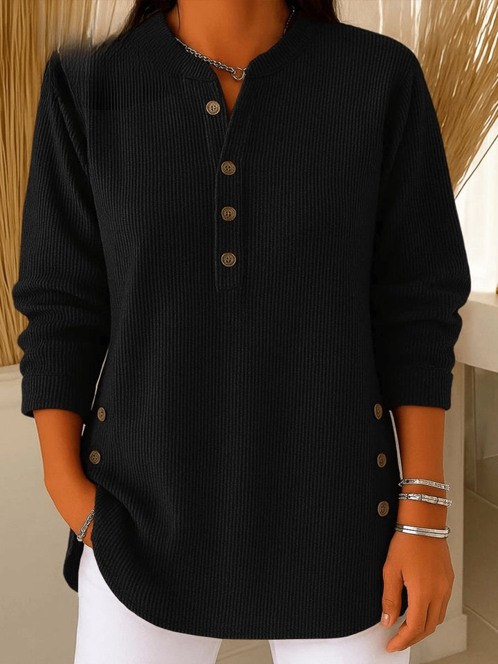 Black ribbed henley tunic top with long sleeves and side button accents