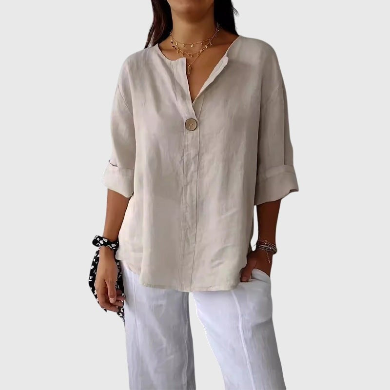 beige linen blouse with V-neck and rolled cuffed sleeves