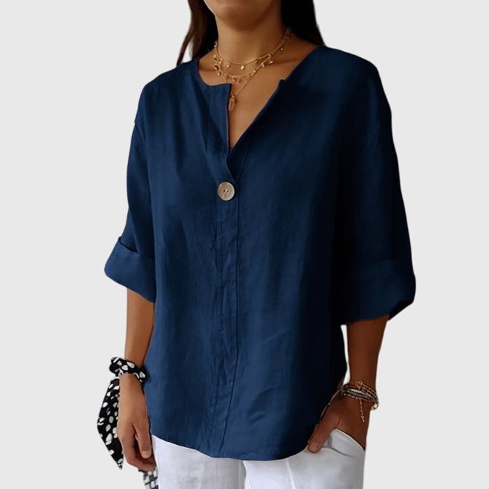 navy blue button-front blouse with split neckline and cuffed sleeves