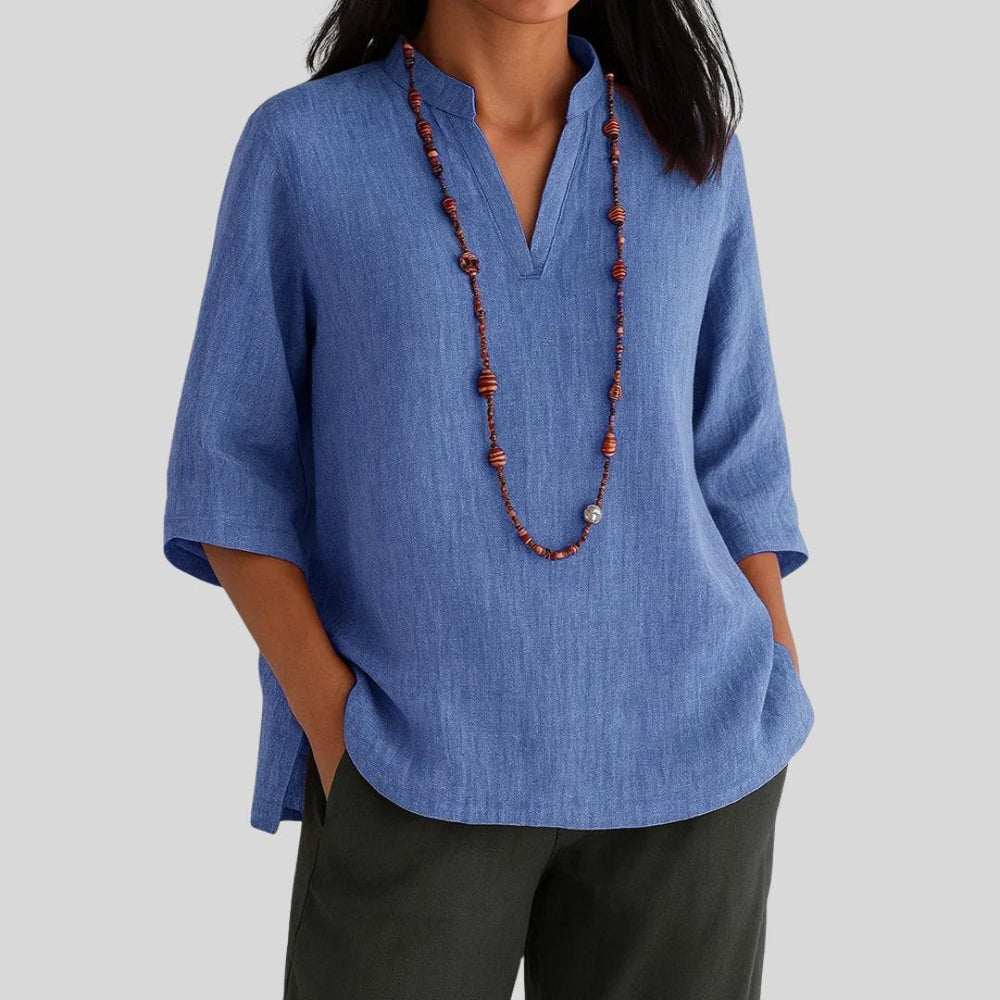 Blue linen tunic featuring notch collar and loose 3/4-length sleeves