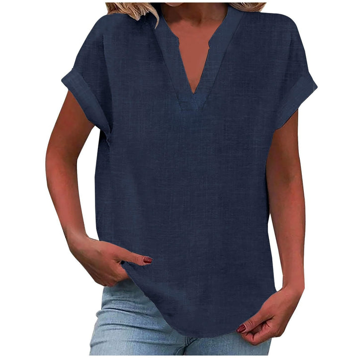 Navy blue split V-neck blouse featuring cuffed sleeves and relaxed fit