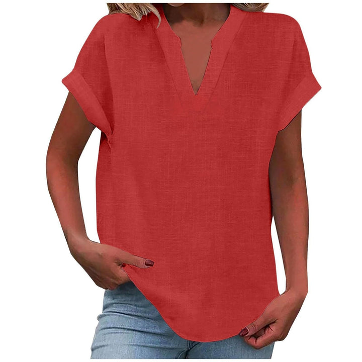 Coral red split-neck blouse with rolled cap sleeves and curved hemline
