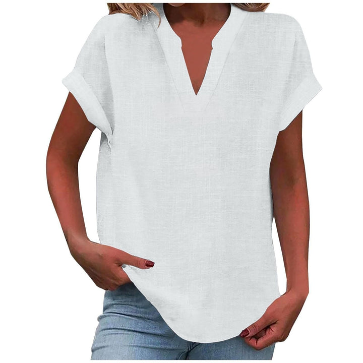 White relaxed V-neck blouse featuring cuffed sleeves and textured fabric