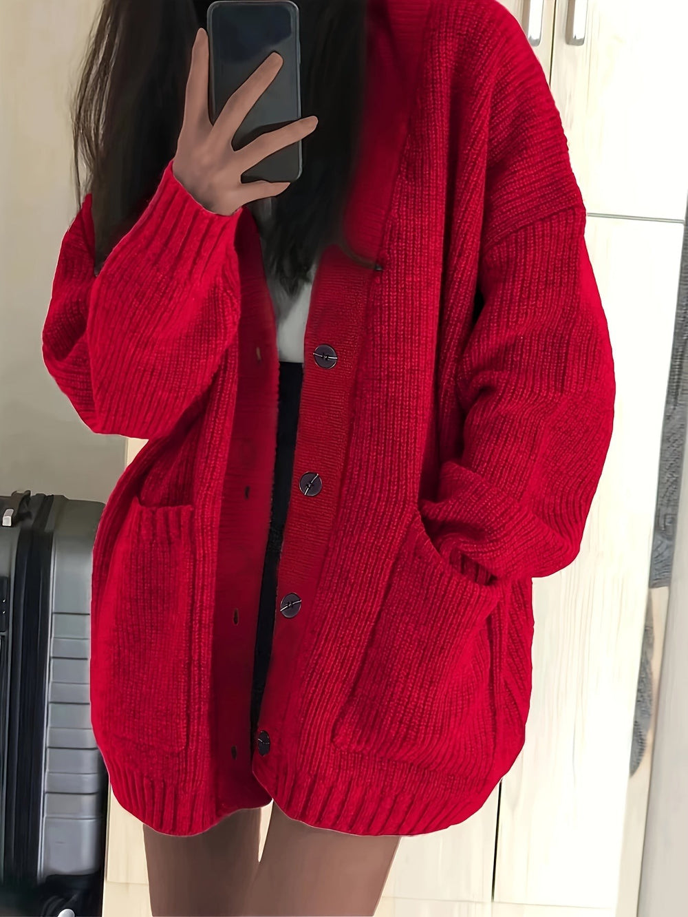 Red ribbed knit oversized cardigan with dark button fastenings