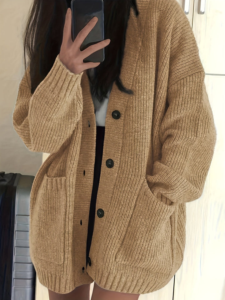 Camel ribbed knit cardigan featuring dark buttons and roomy pockets