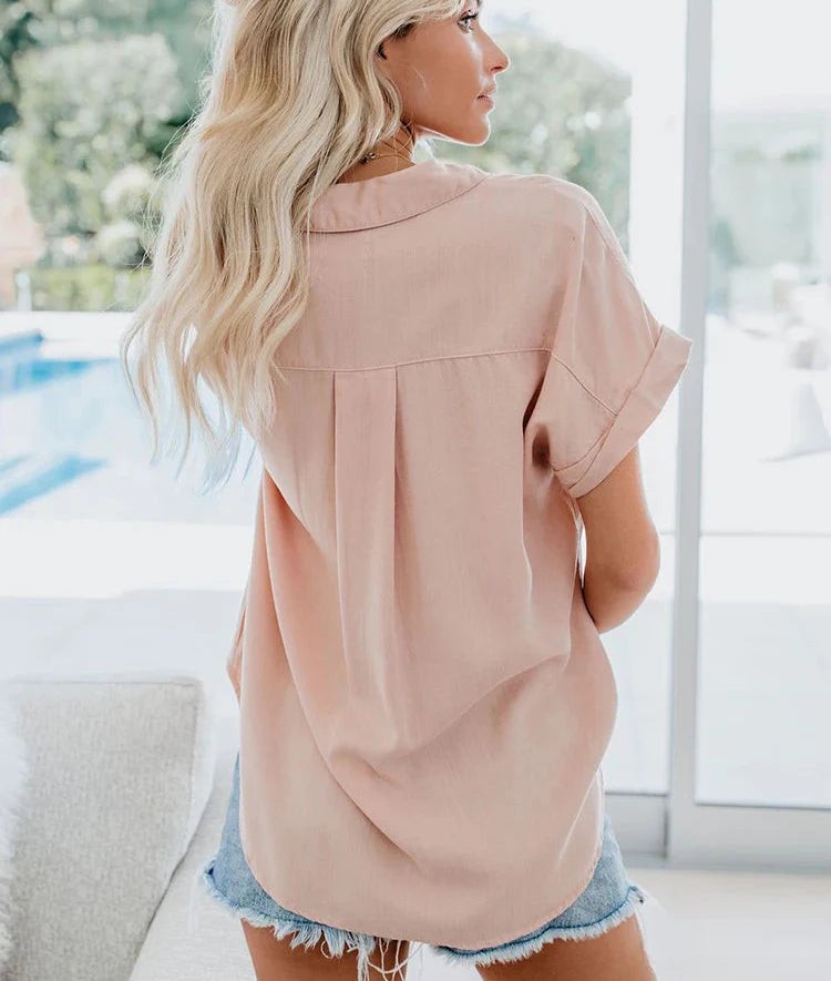 back view of blush pink casual blouse showing pleated yoke detail